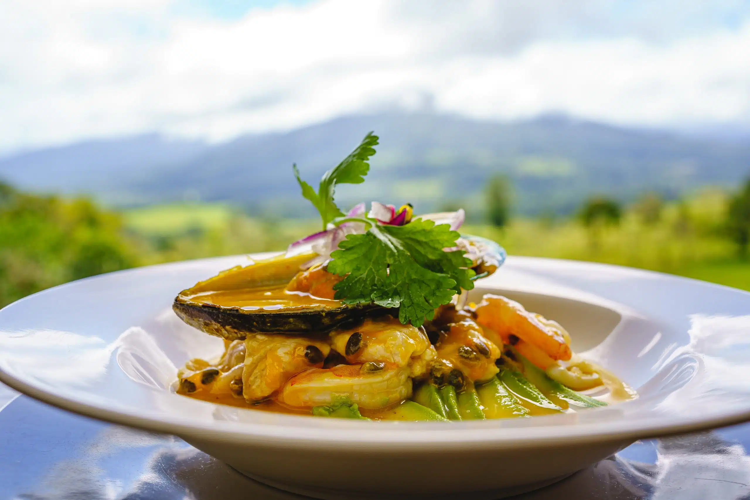 A,Plate,Of,Ceviche,Garnished,With,Herbs,On,A,Table